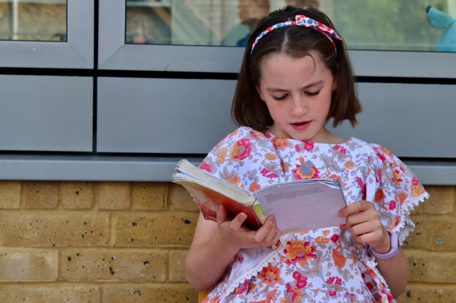 A child working confidently with a script